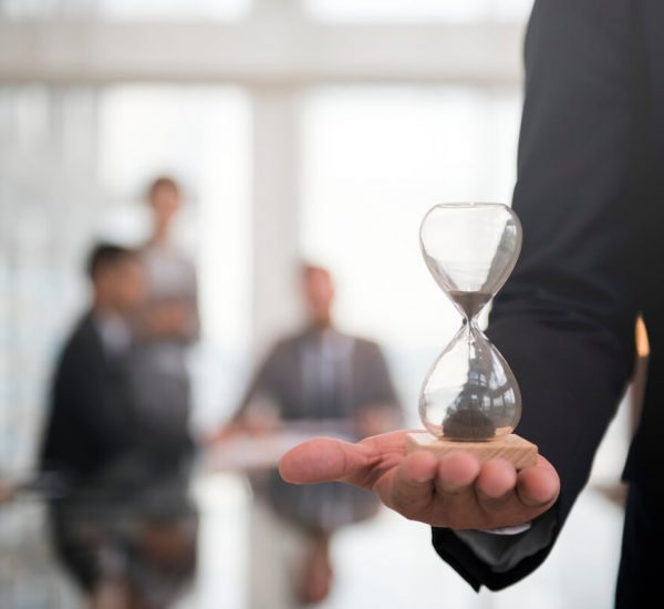 businessman-holding-hour-glass-signifies-importance-being-time (1) (1)